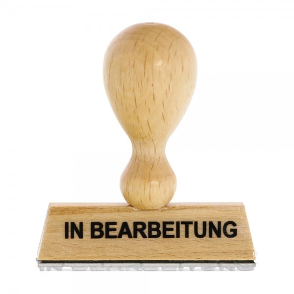 Holzstempel mit Standardtext &quot;IN BEARBEITUNG&quot;
